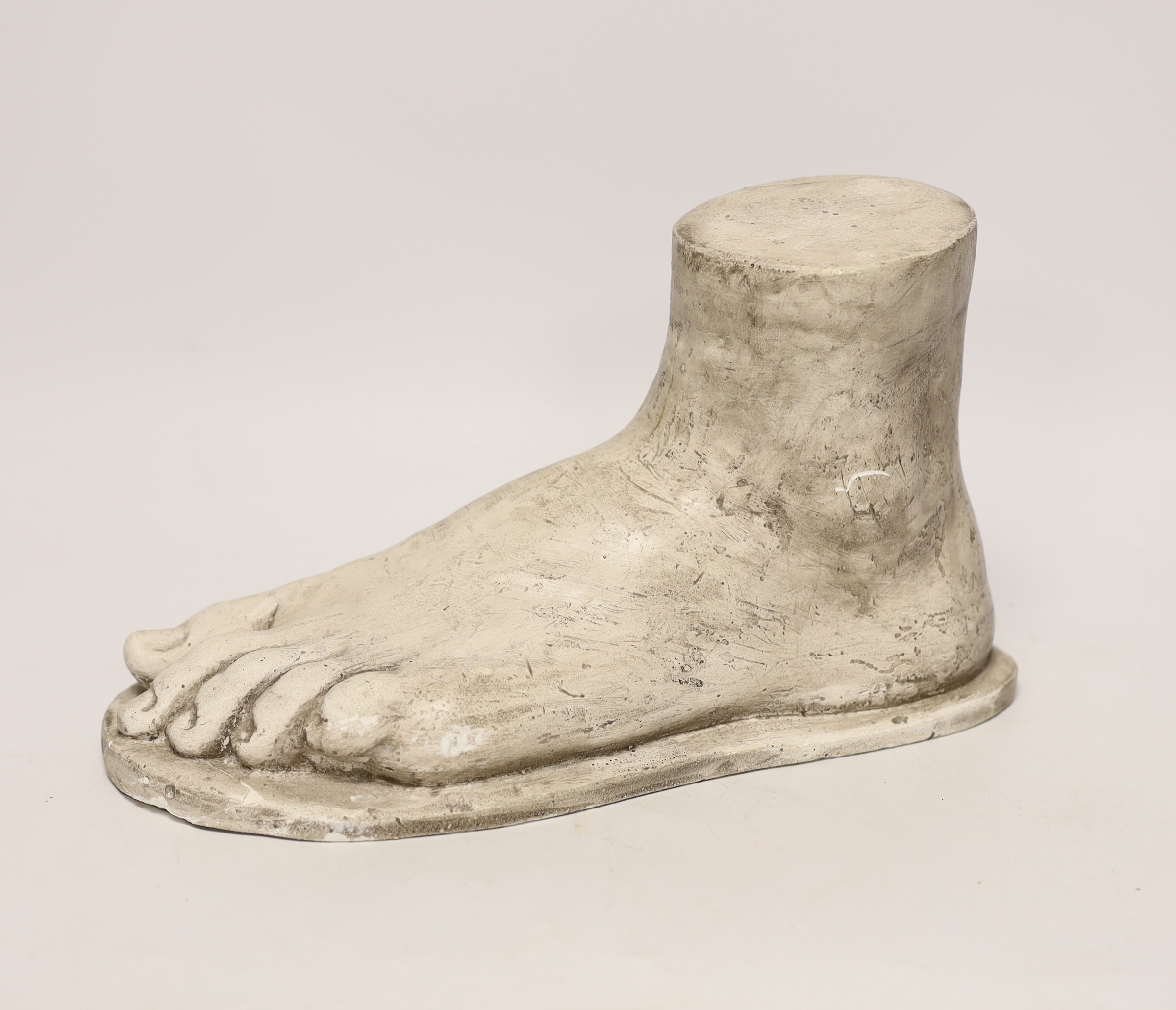 A composite marble foot, 28cm long, 17cm high